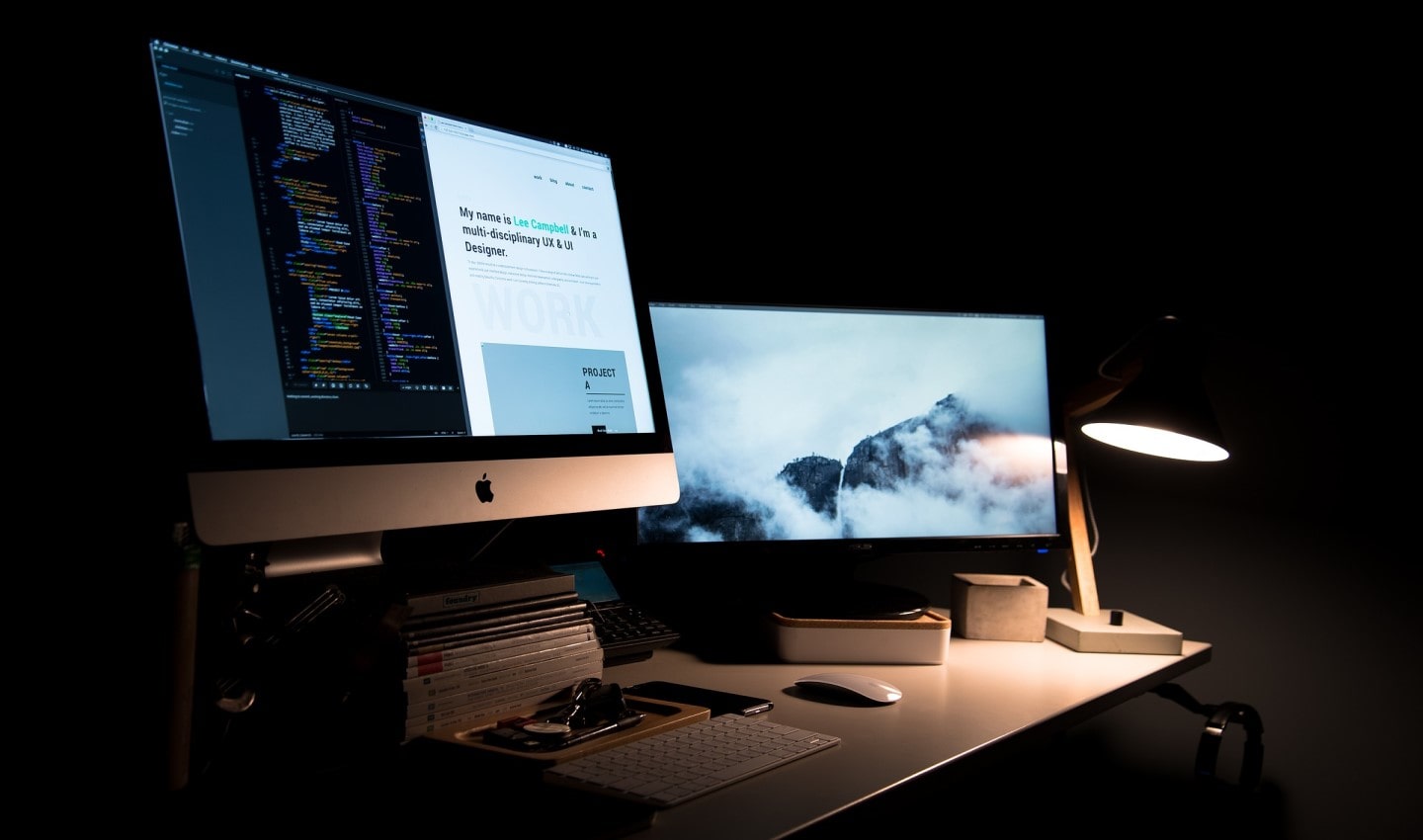 desktop iMac computers at night