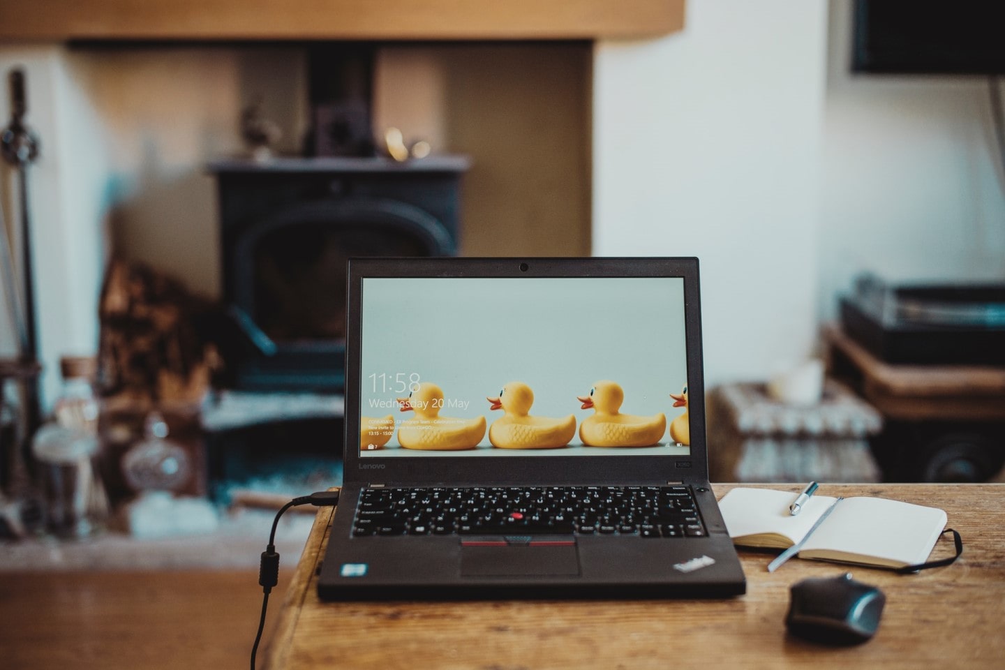 laptop plugged in with rubber duck wallpaper