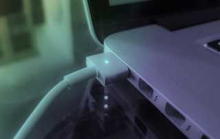Apple Macbook laptop plugged in and charging
