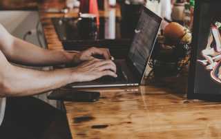 Person using laptop on desk