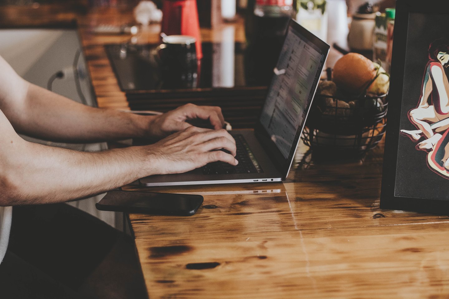Person using laptop on desk