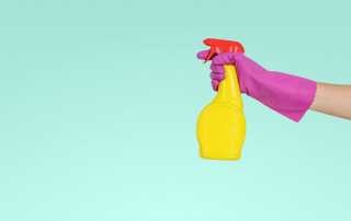 cleaning spray used with purple gloves