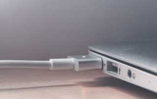 Apple MacBook laptop plugged in charging