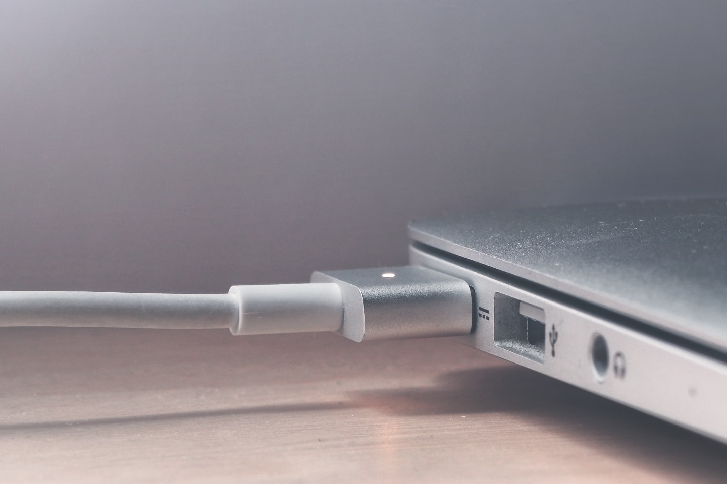 Apple MacBook laptop plugged in charging