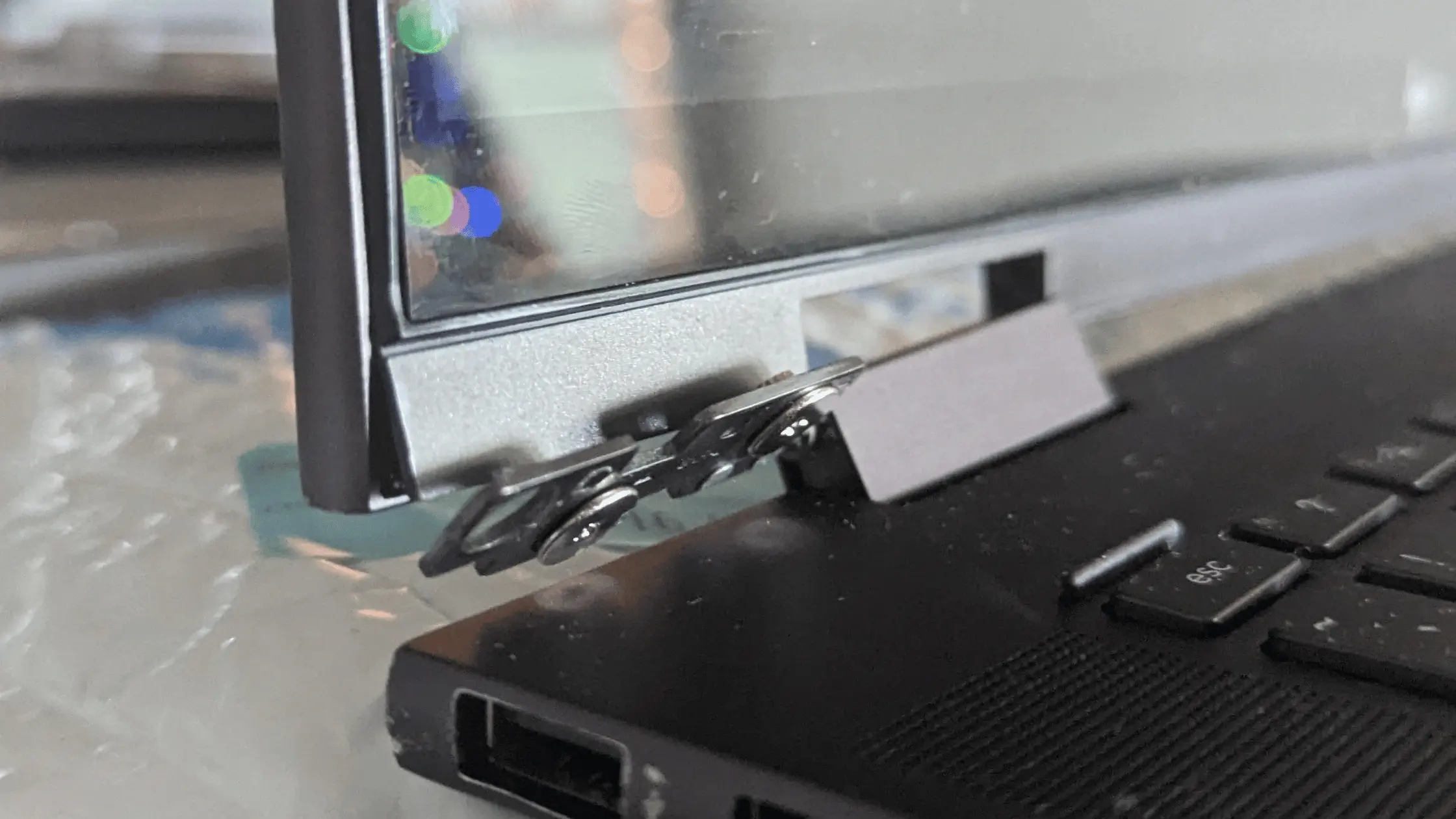 HP Envy x360 laptop with damaged hinge