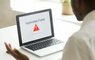 man with broken laptop