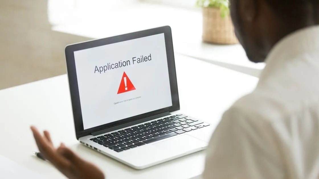 man with broken laptop